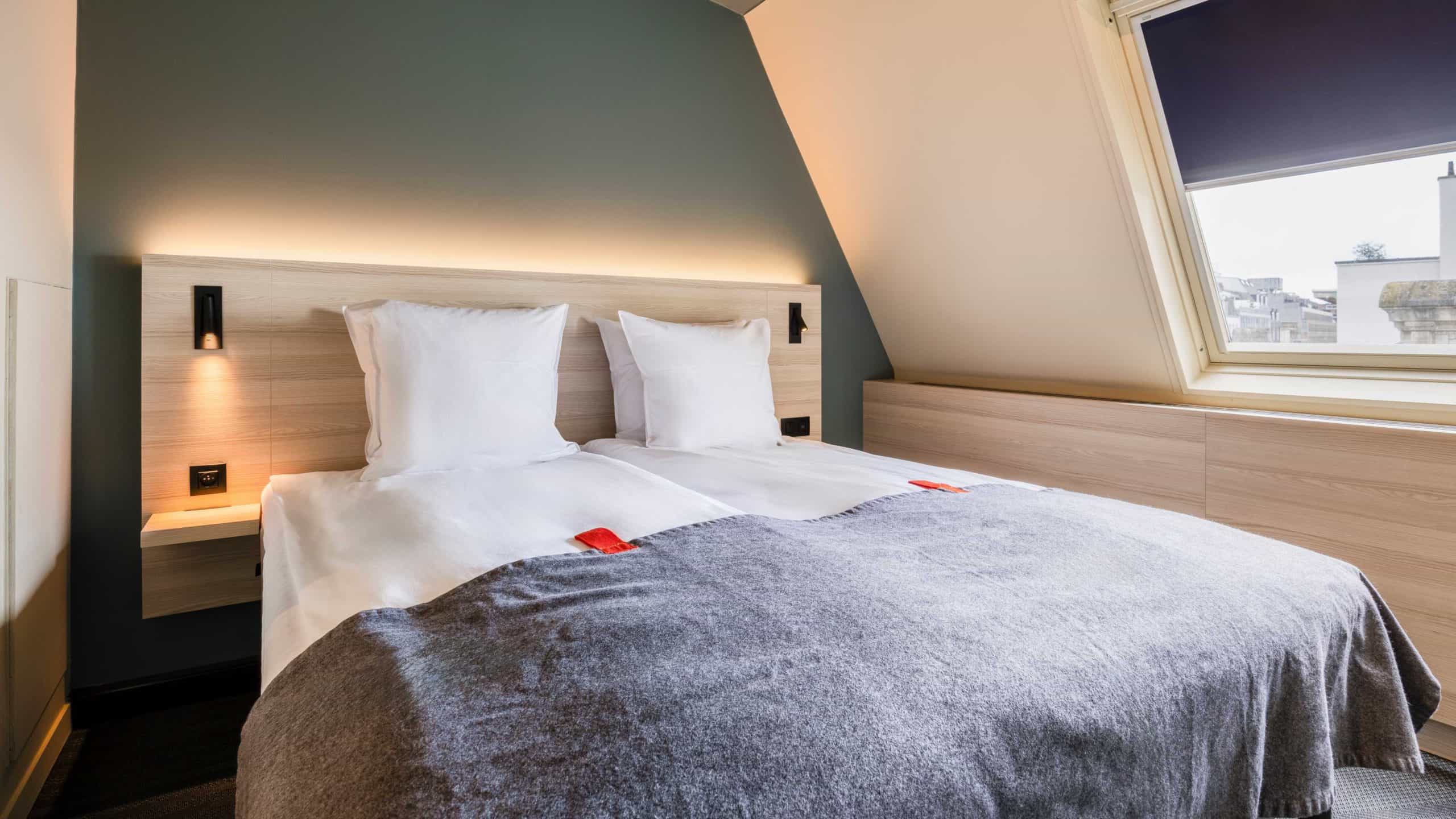 Picture of bed in double room small at Citybox Brussels